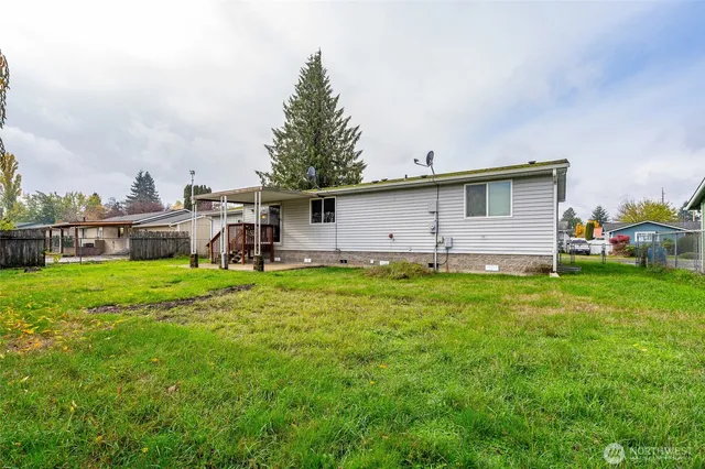 a front view of house with yard and seating area