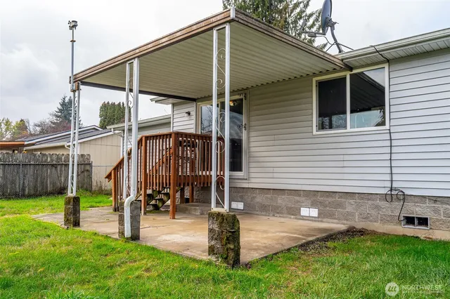 a front view of house with yard and outdoor seating