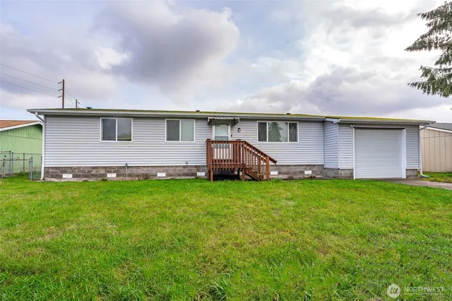 a front view of house with yard and barbeque oven