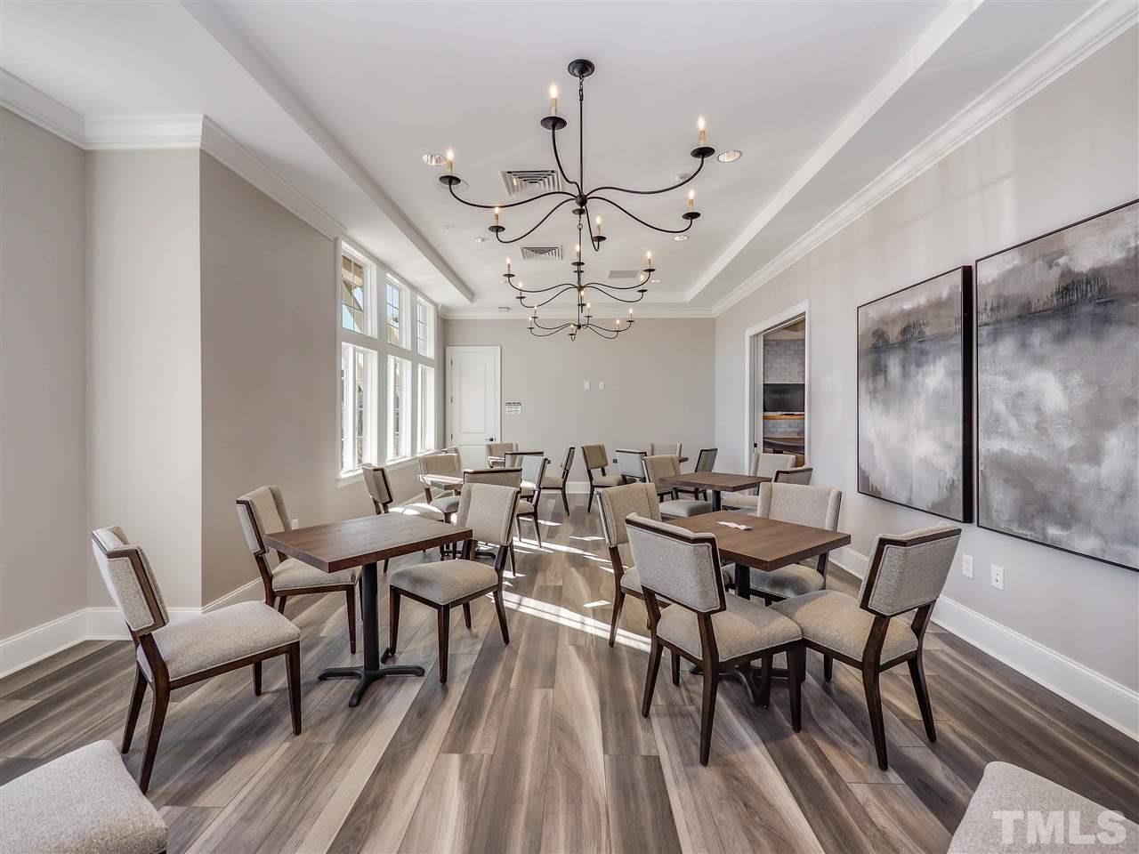 154 Mahogany Run, Unit 148 Raleigh, NC 27610 - Photo 14 of 29 a view of a dining room with furniture window and wooden floor