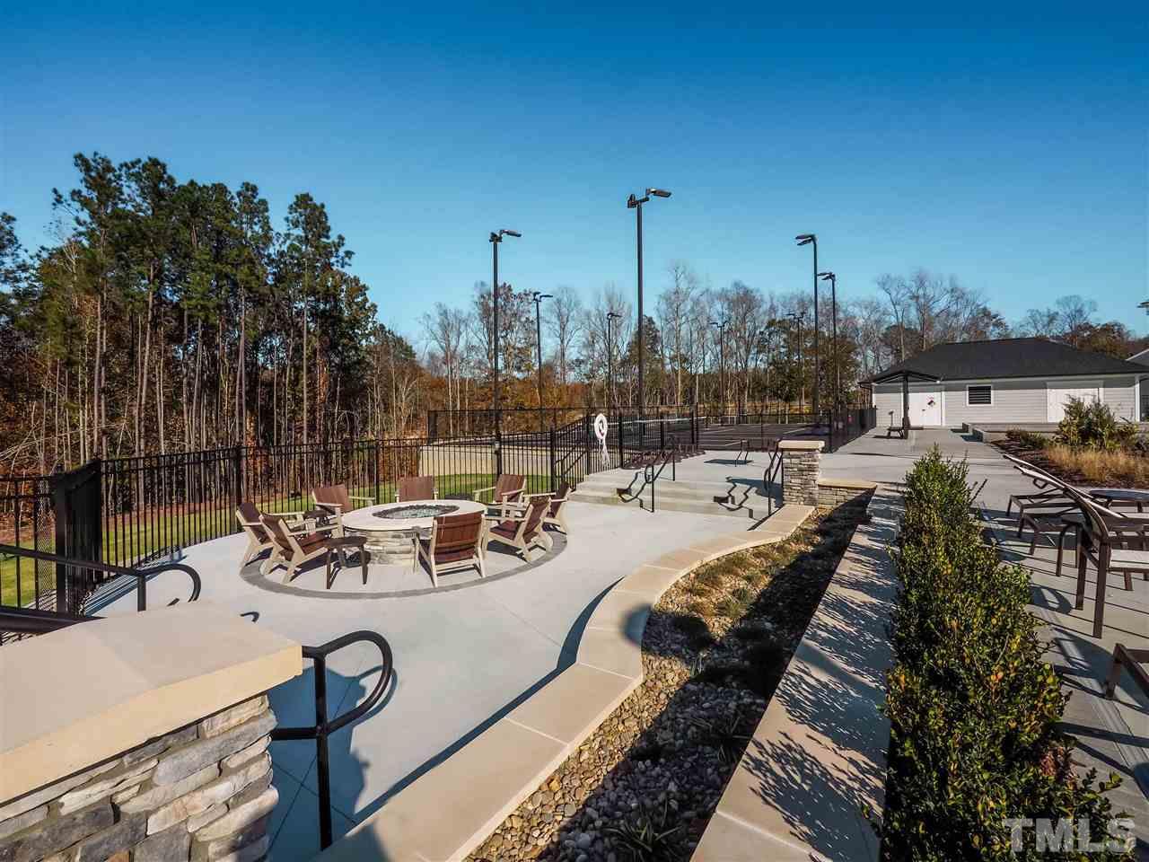 154 Mahogany Run, Unit 148 Raleigh, NC 27610 - Photo 3 of 29 a view of a swimming pool with chairs