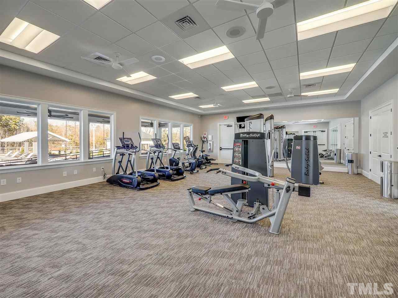 154 Mahogany Run, Unit 148 Raleigh, NC 27610 - Photo 8 of 29 a view of a room with gym equipment