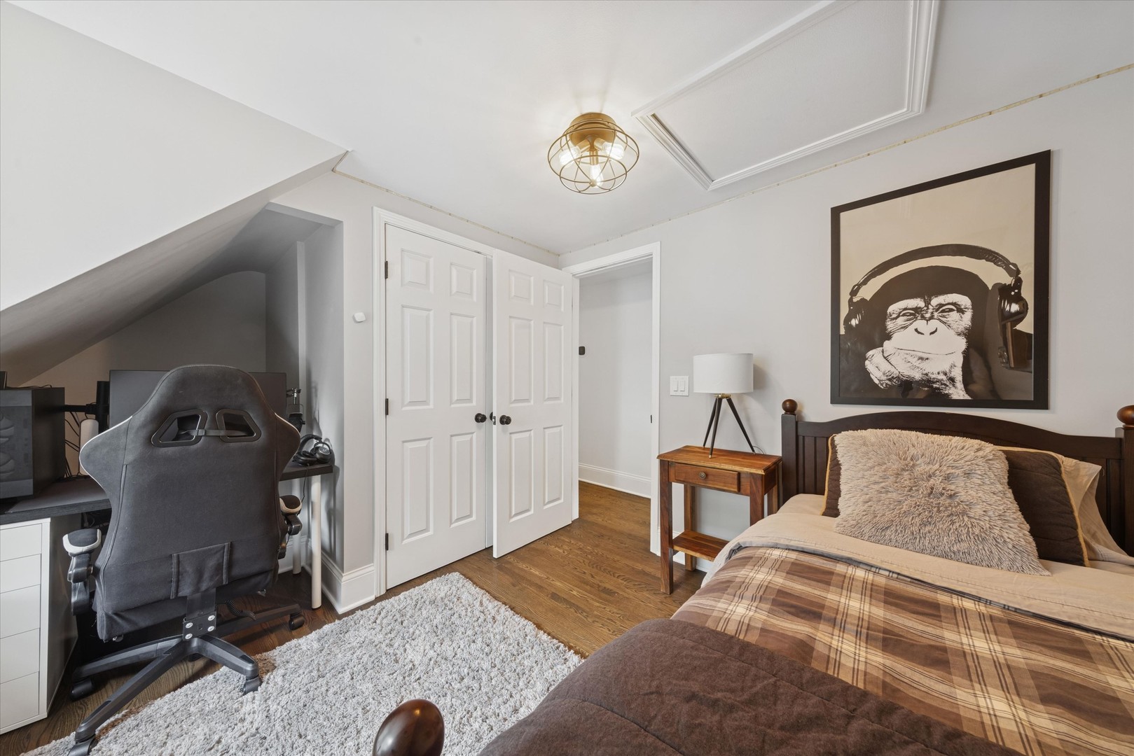 561 North County Line Road Hinsdale, IL 60521 - Photo 14 of 30 a bedroom with a bed and a chandelier