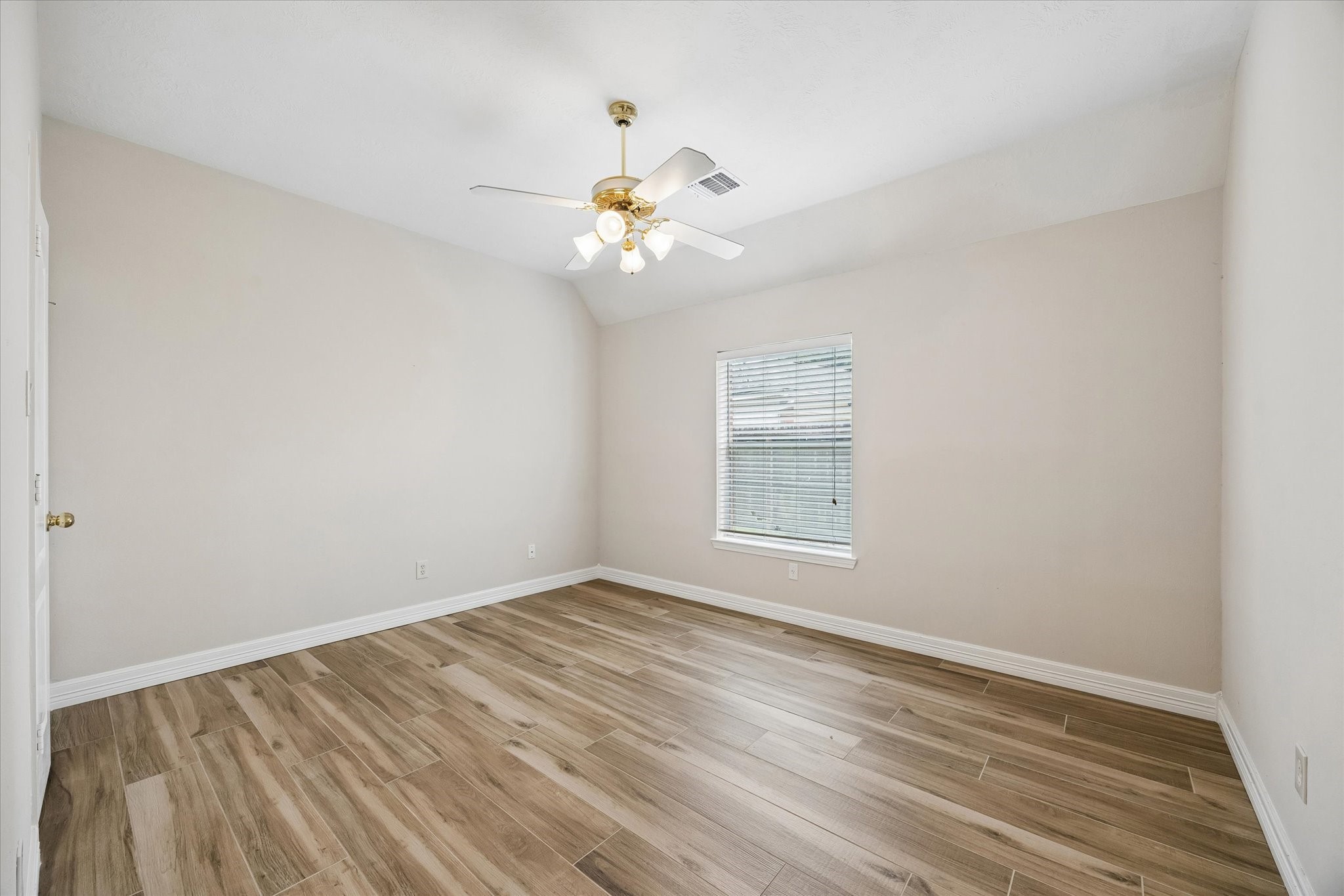 5306 Summerland Ridge Court Houston, TX 77041 - Photo 20 of 33 wooden floor in an empty room with a window