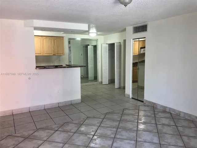 a view of a bathroom with a shower and a sink
