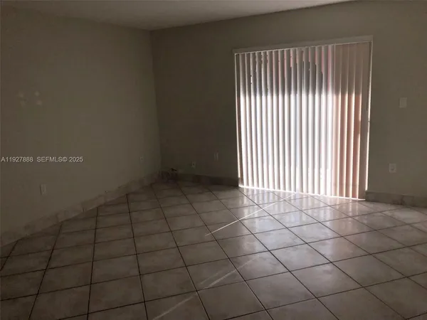 en empty room with a window