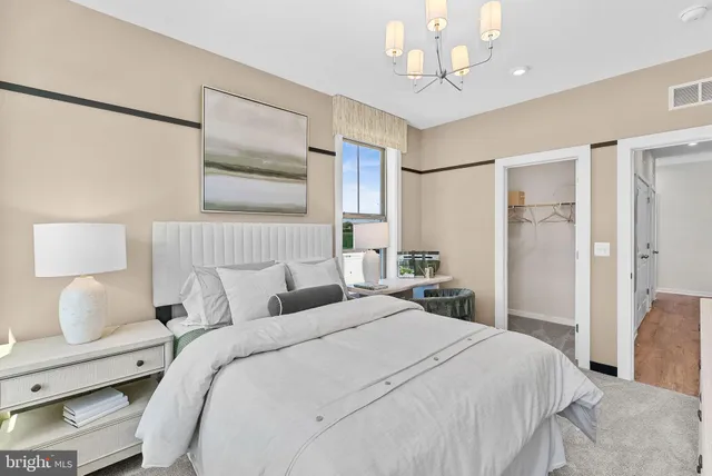 a bedroom with double bed and window