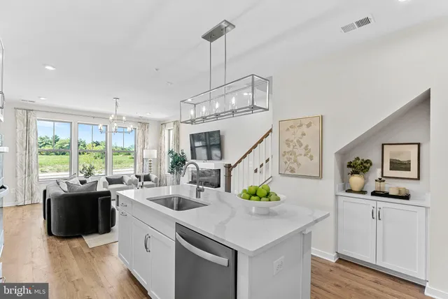 a kitchen with counter space appliances and windows