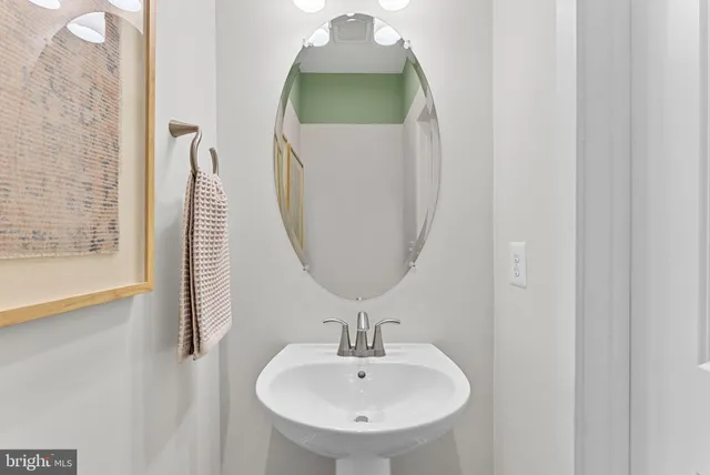 a bathroom with a sink and mirror