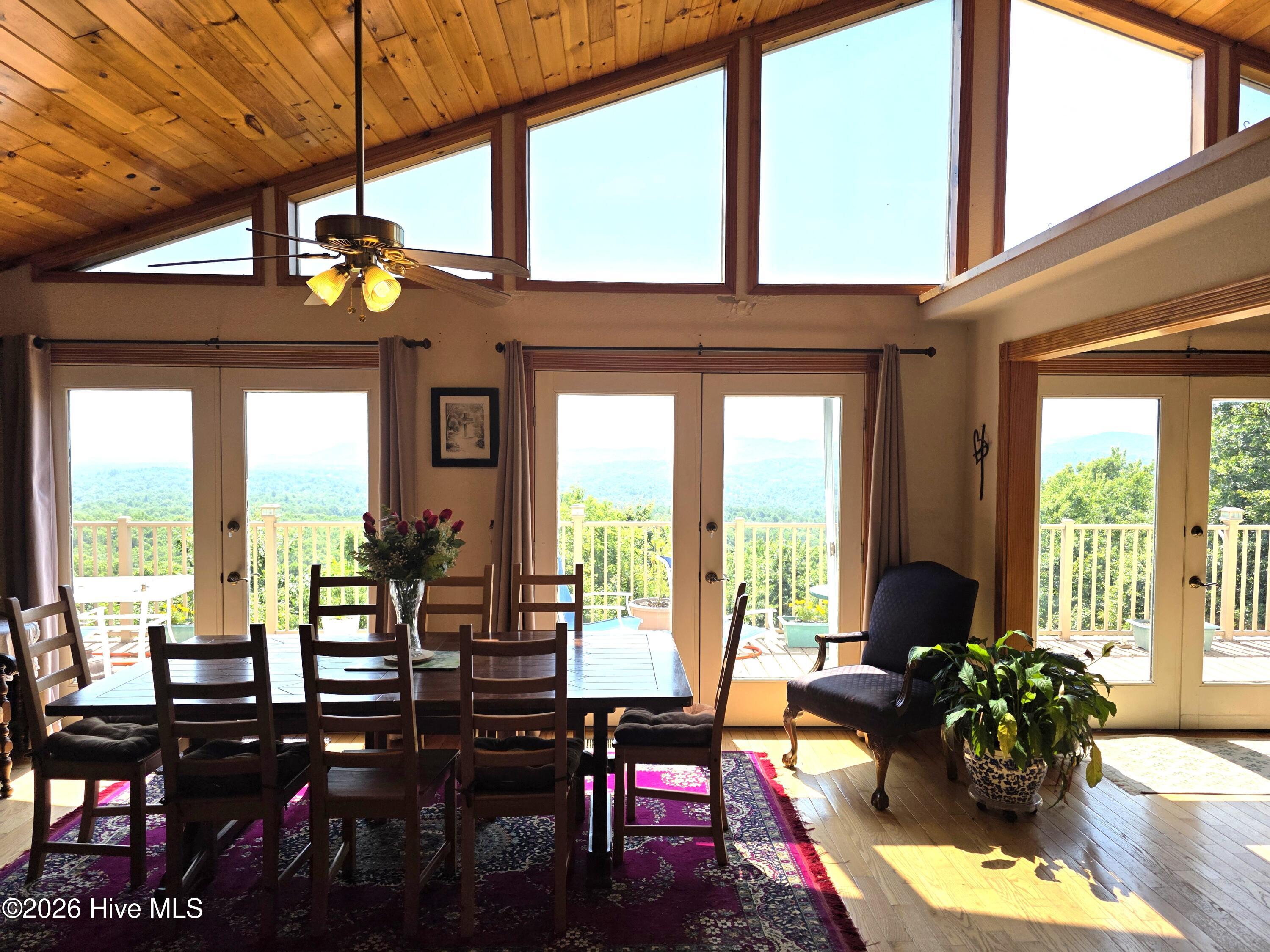 798 Timberwood Hills Road Murphy, NC 28906 - Photo 9 of 23 FORML DINING AREA W/ CLERESTORY WINDOWS AND FRENCH DOORS