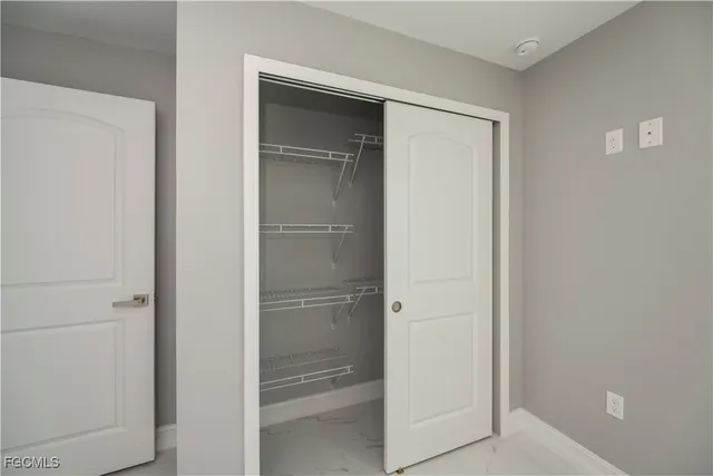 a bathroom with a glass door shower
