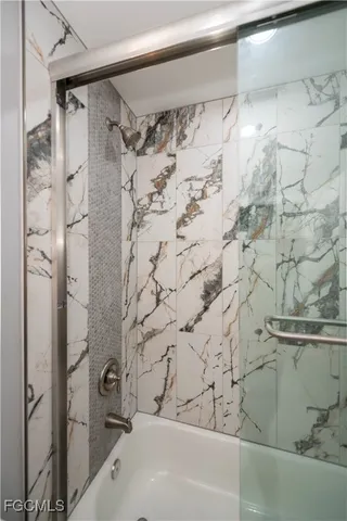 a bathroom with a shower and a bathtub