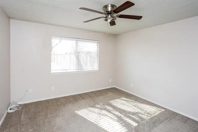 a view of a big room with carpet