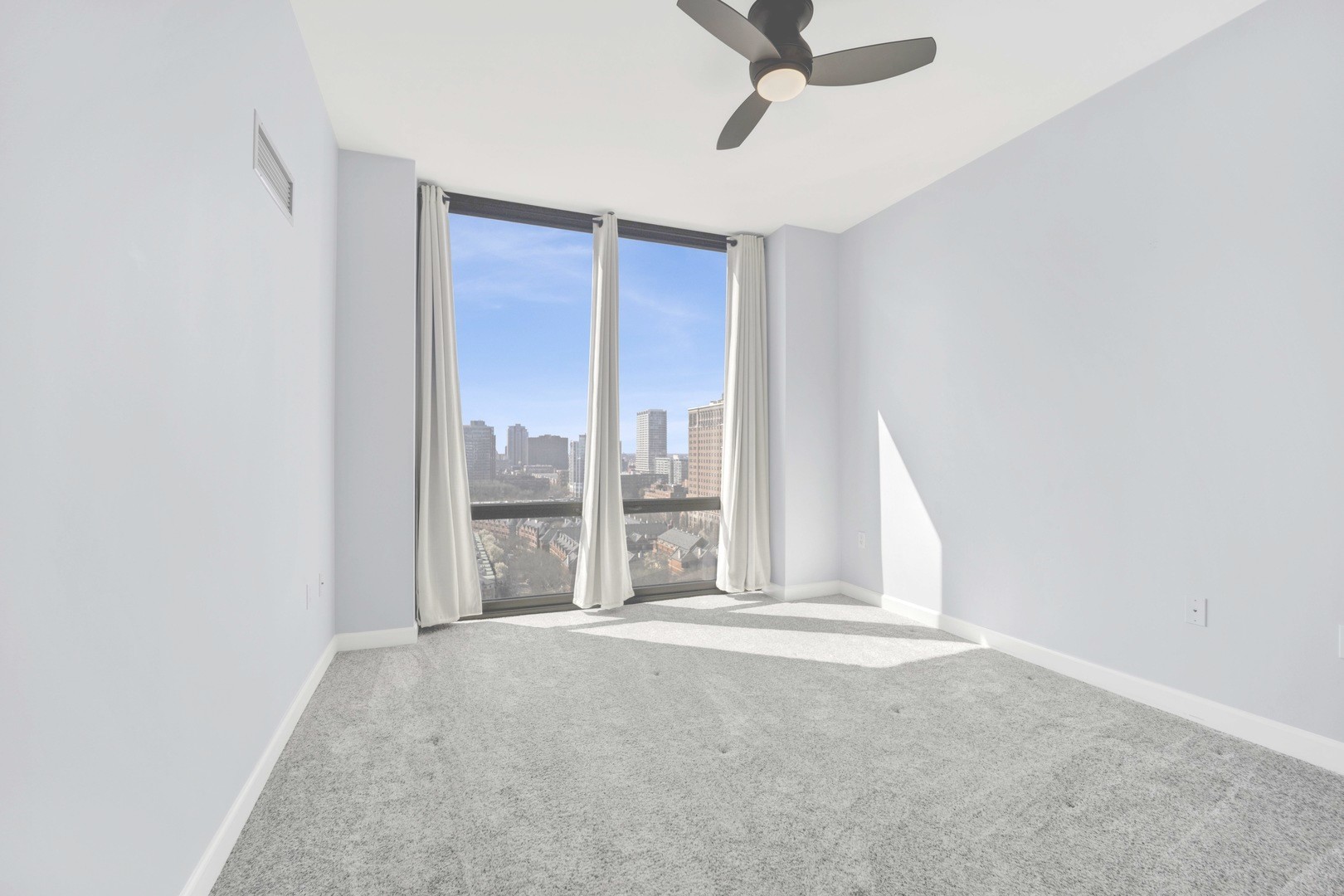 233 East 13th Street, Unit 1708 Chicago, IL 60605 - Photo 11 of 15 a view of livingroom with hardwood floor and window
