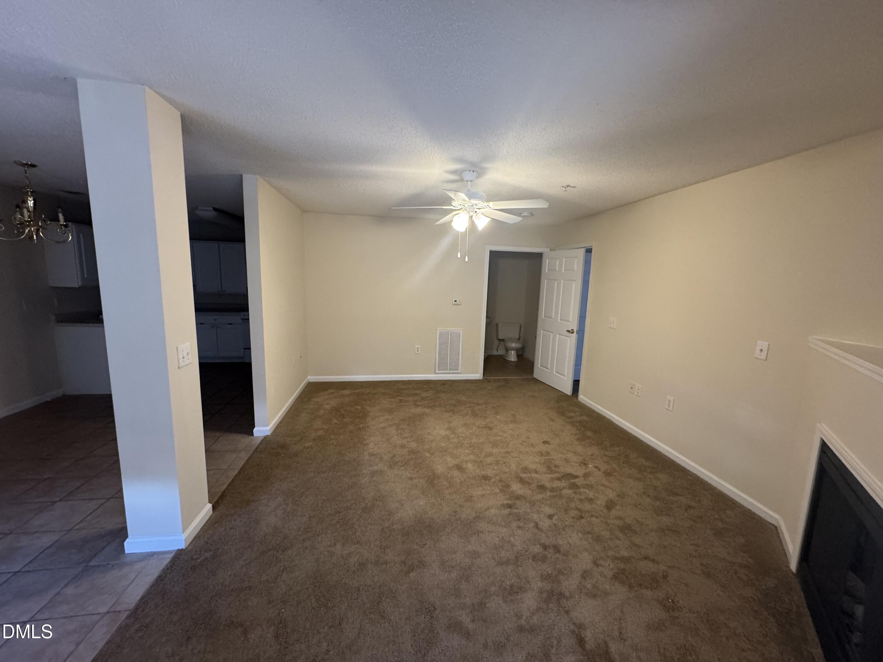 2511 Huntscroft Lane, Unit 101 Raleigh, NC 27617 - Photo 5 of 11 a view of a room with an empty space