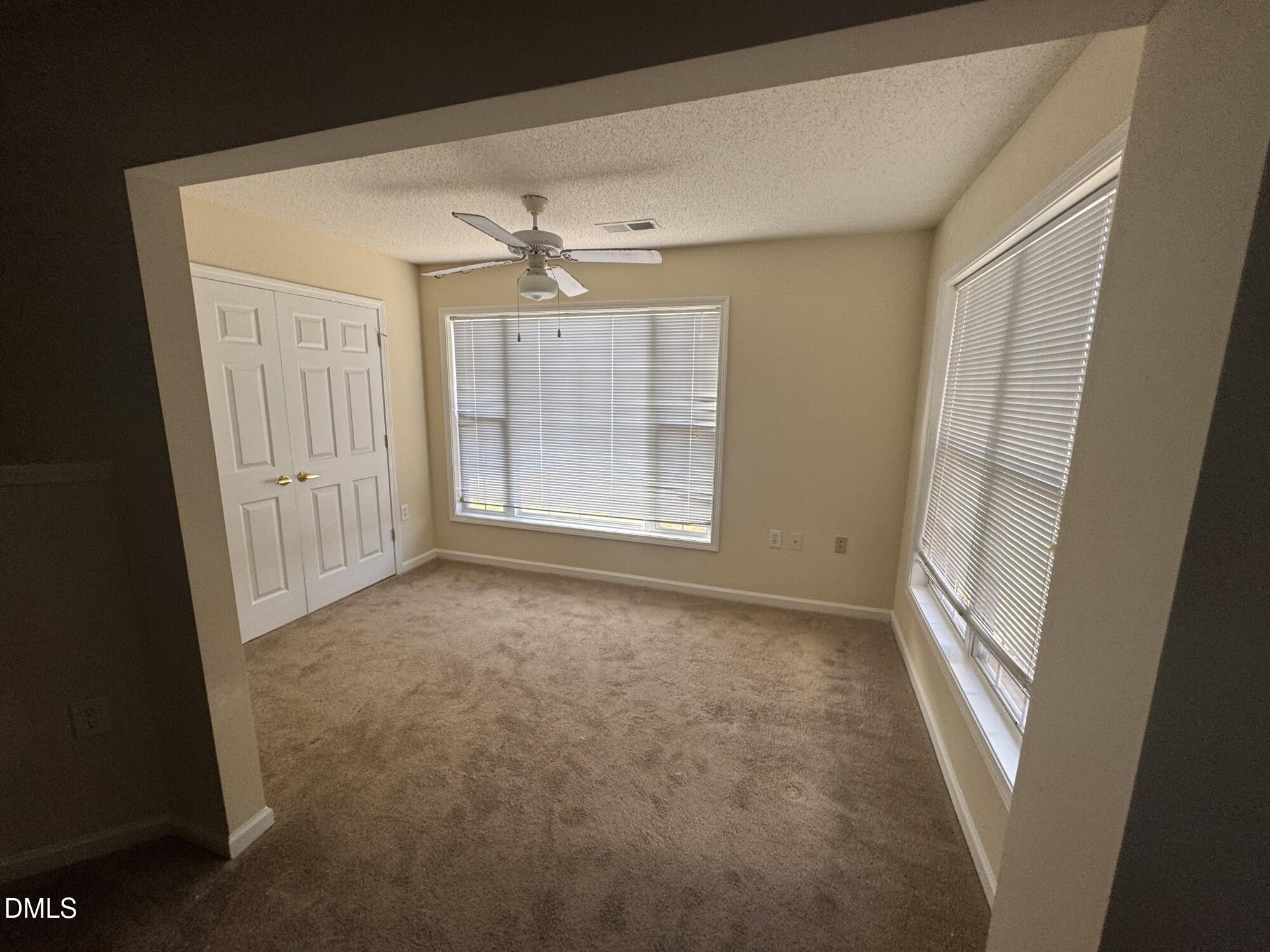 2511 Huntscroft Lane, Unit 101 Raleigh, NC 27617 - Photo 7 of 11 a view of an empty room with a window