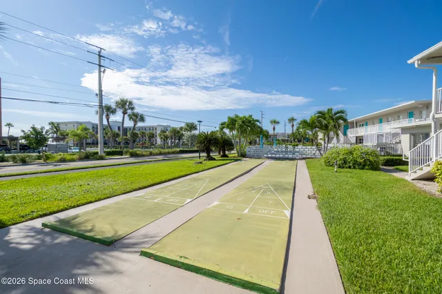 a view of swimming pool is middle in the garden