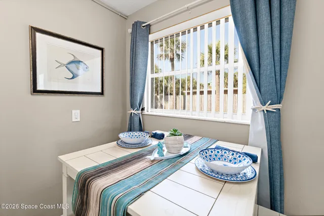 a bedroom with a bed and a tv on table