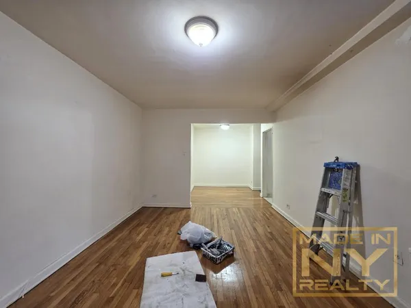 a view of a livingroom with wooden floor