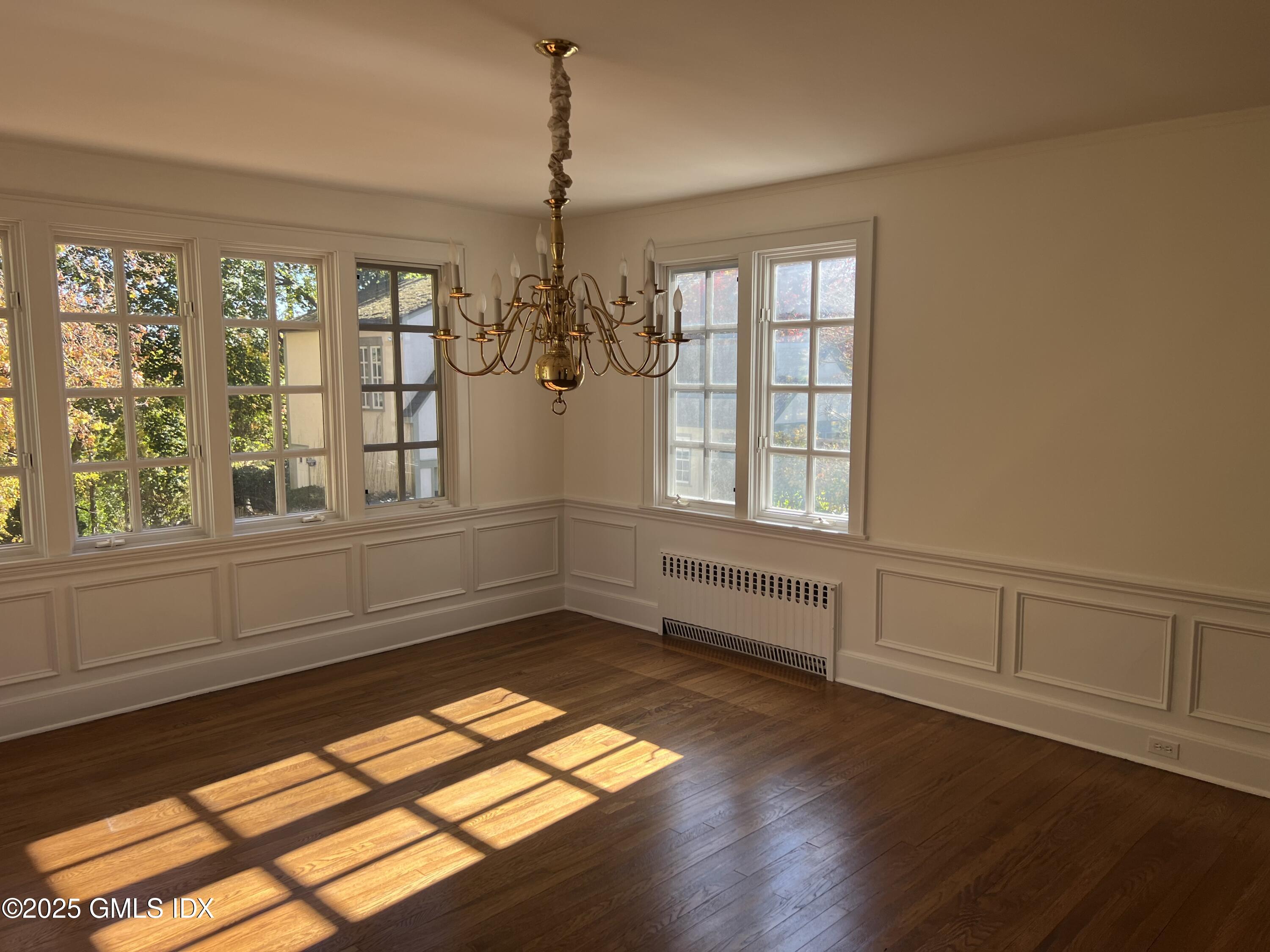 11 Stanwich Road Greenwich, CT 06830 - Photo 11 of 25 a view of empty room with wooden floor and fan