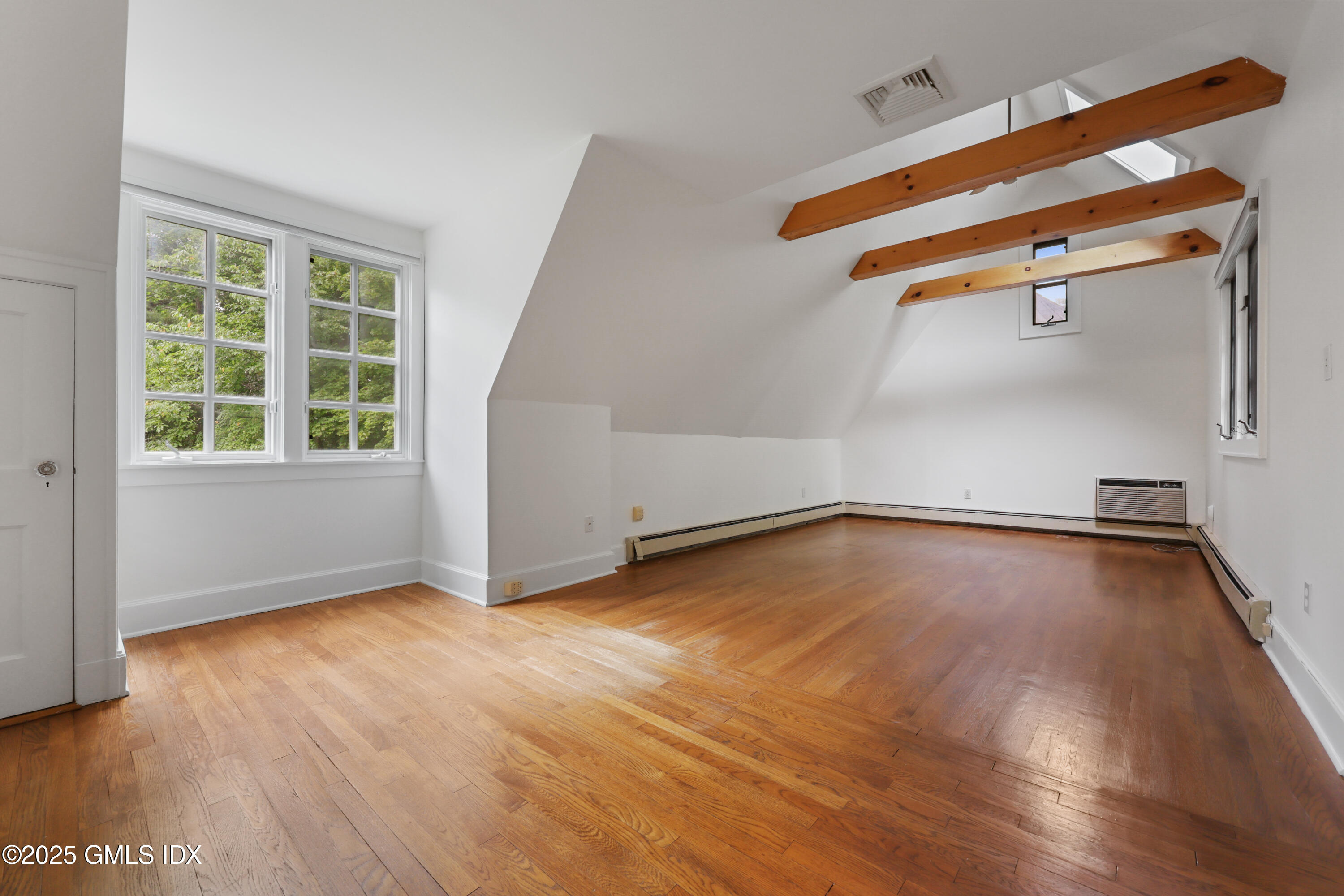 11 Stanwich Road Greenwich, CT 06830 - Photo 14 of 25 an empty room with wooden floor and windows
