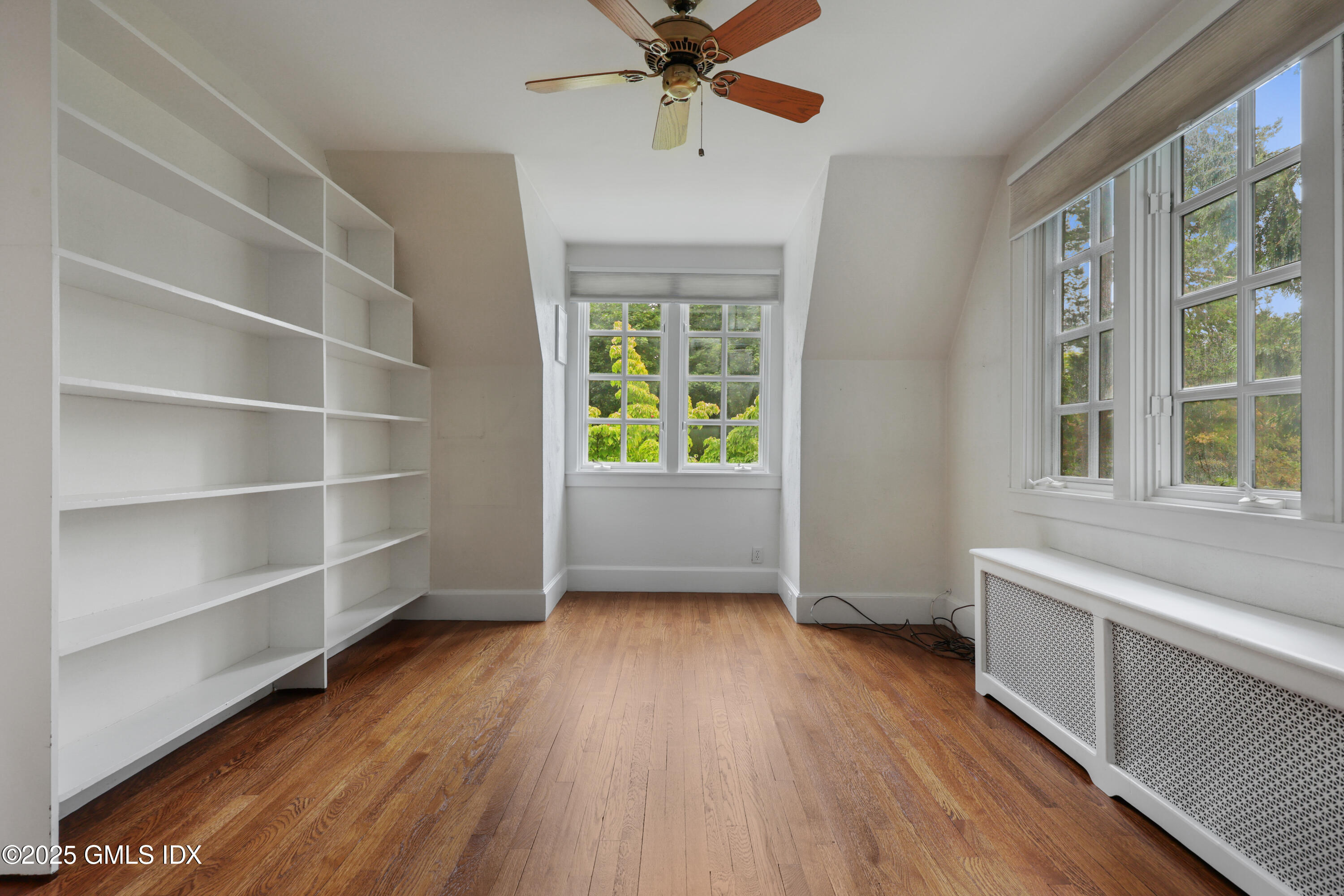 11 Stanwich Road Greenwich, CT 06830 - Photo 18 of 25 a view of an empty room with a window and wooden floor
