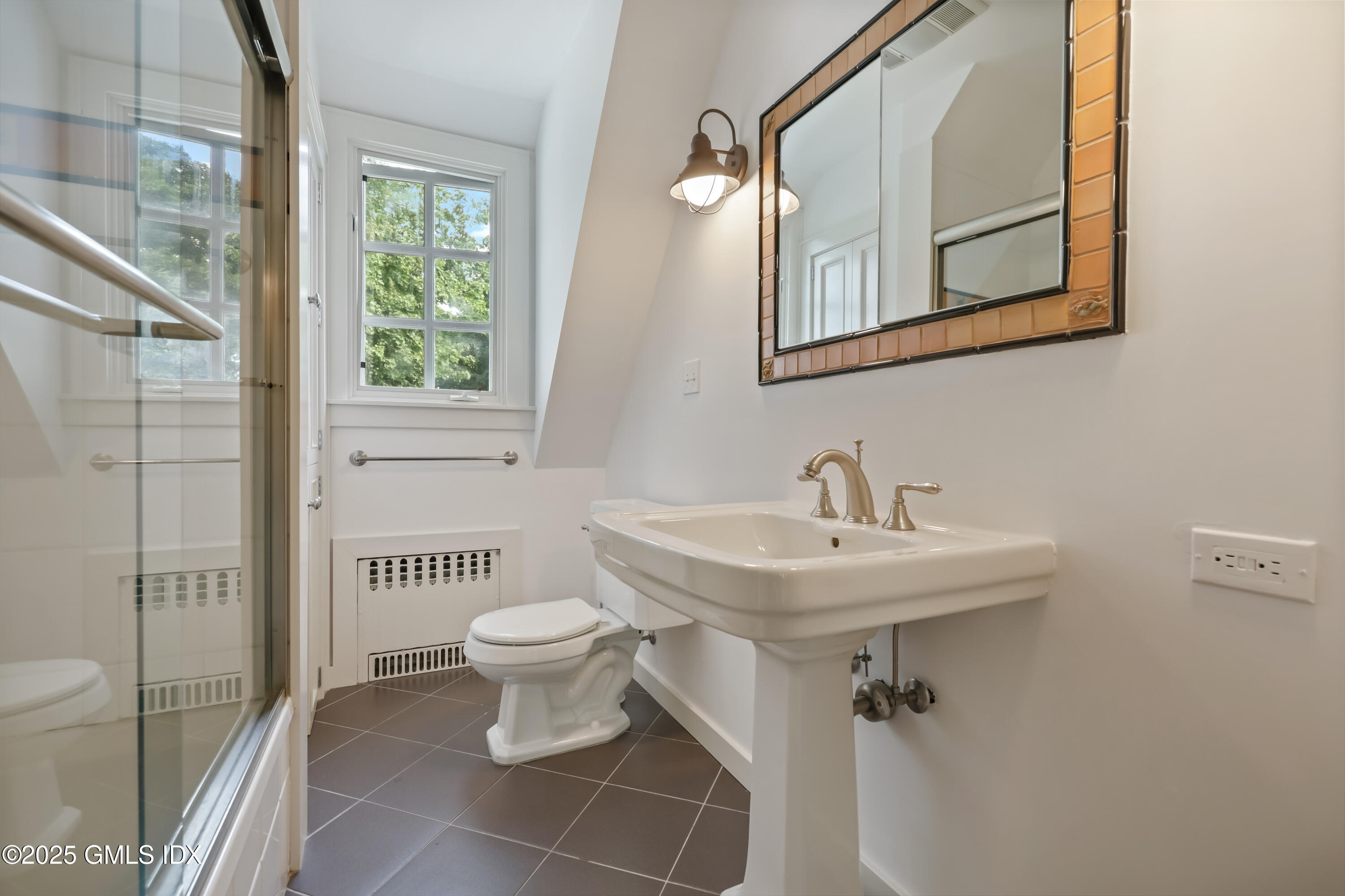 11 Stanwich Road Greenwich, CT 06830 - Photo 20 of 25 a bathroom with a toilet sink and mirror