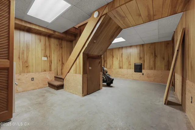 a view of an empty room with stairs