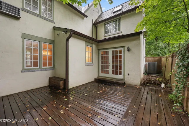 a view of a house with a door and wooden floor