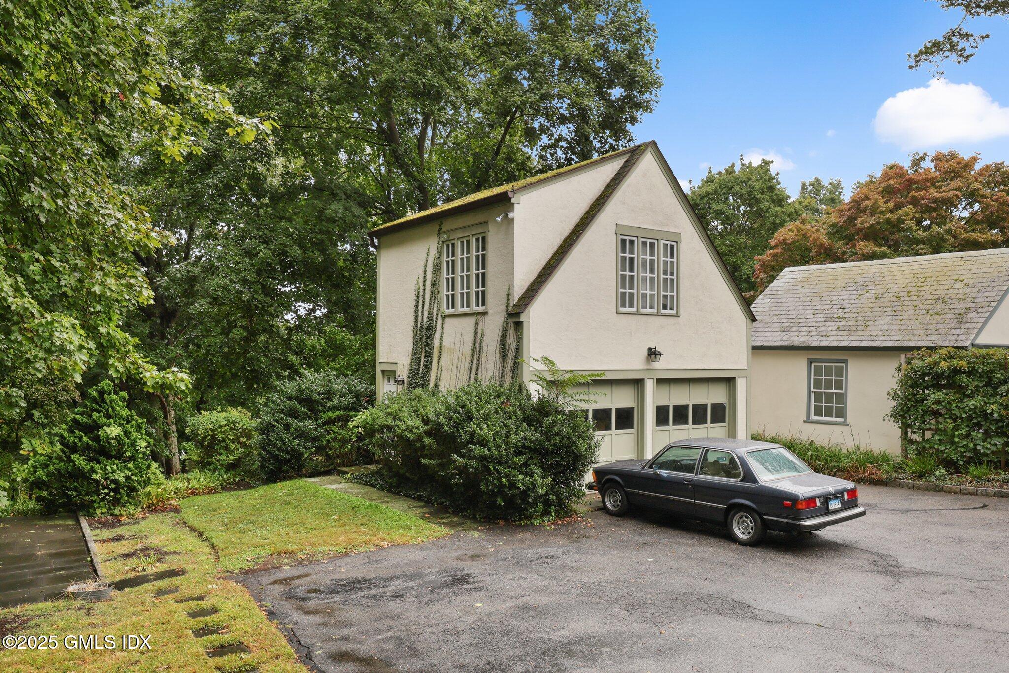 11 Stanwich Road Greenwich, CT 06830 - Photo 25 of 25 a car parked in front of white house