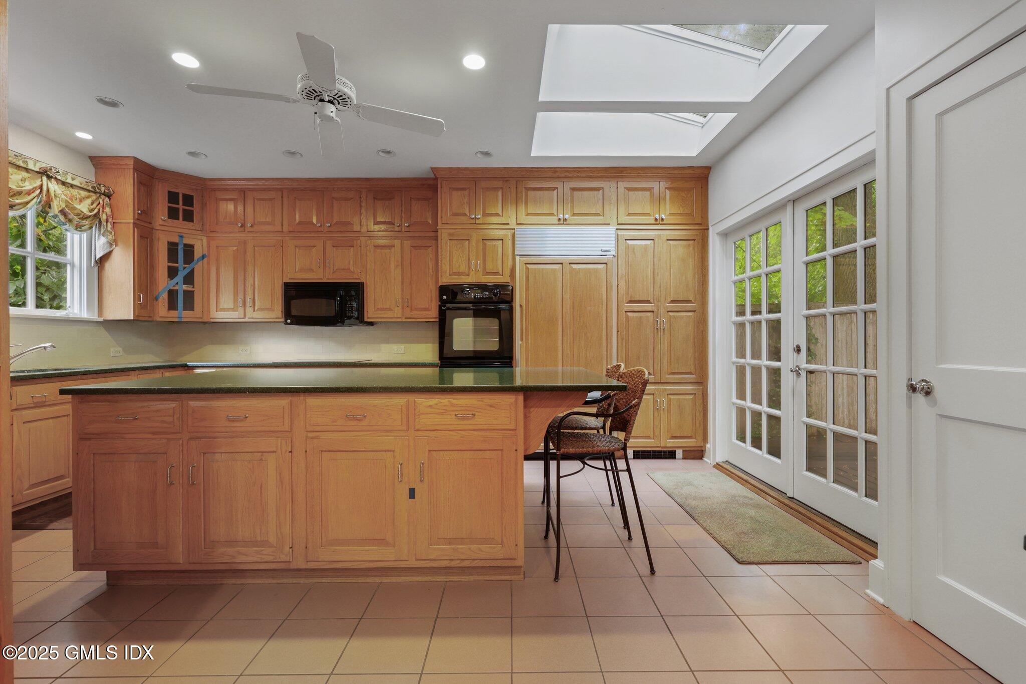 11 Stanwich Road Greenwich, CT 06830 - Photo 6 of 25 a kitchen with stainless steel appliances granite countertop a sink and a refrigerator
