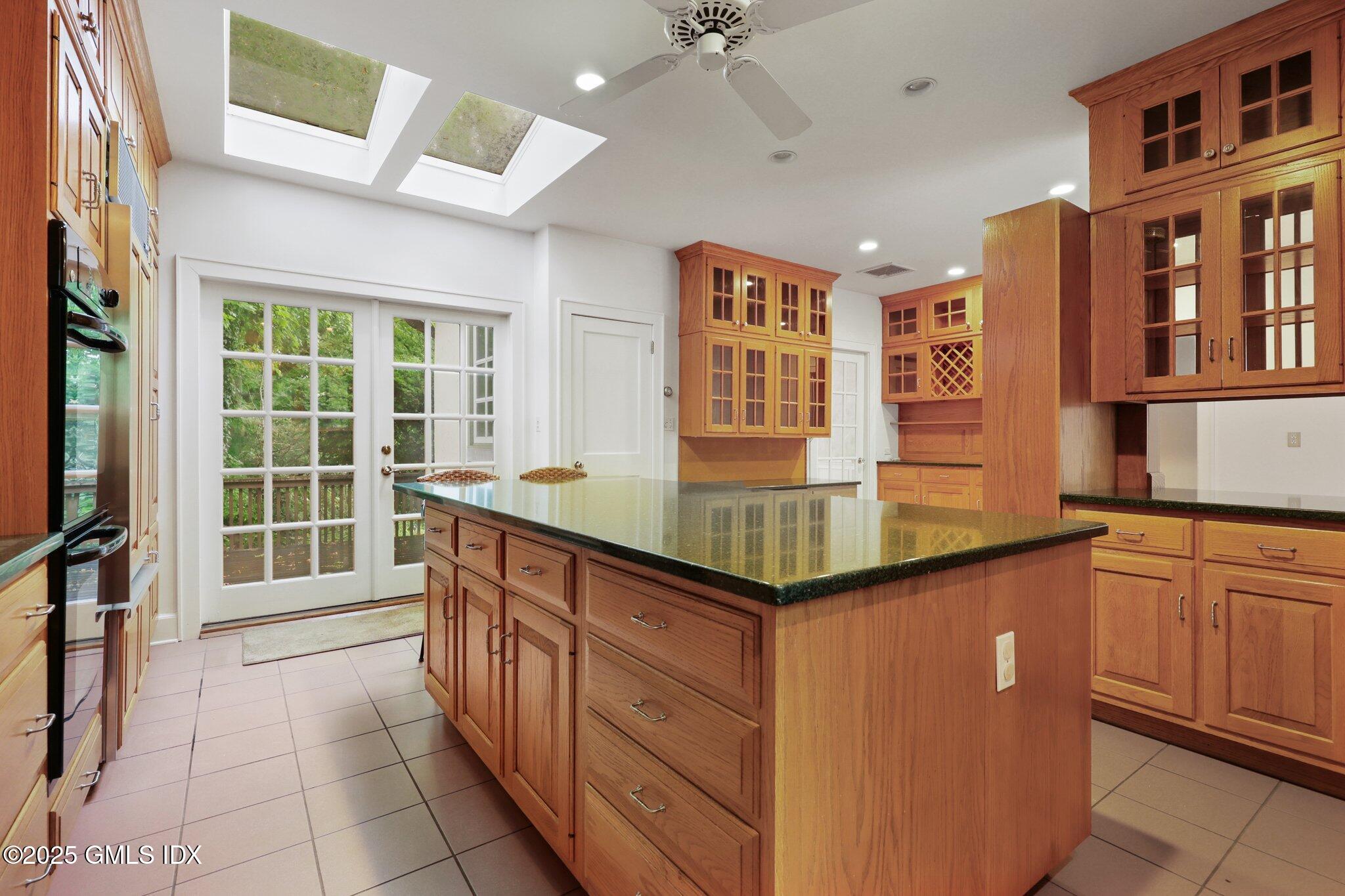 11 Stanwich Road Greenwich, CT 06830 - Photo 7 of 25 a kitchen with stainless steel appliances granite countertop a sink and cabinets
