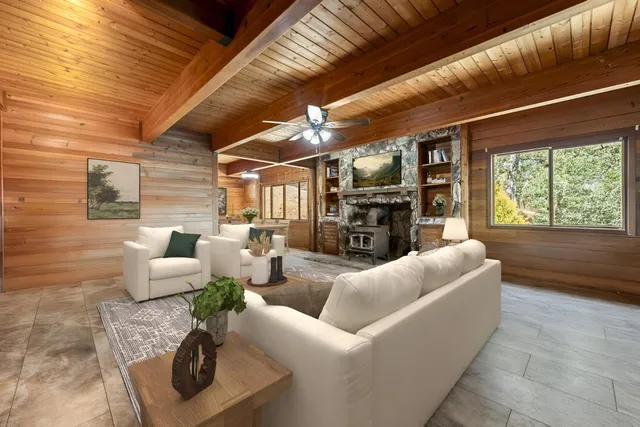 a view of swimming pool with outdoor seating and plants
