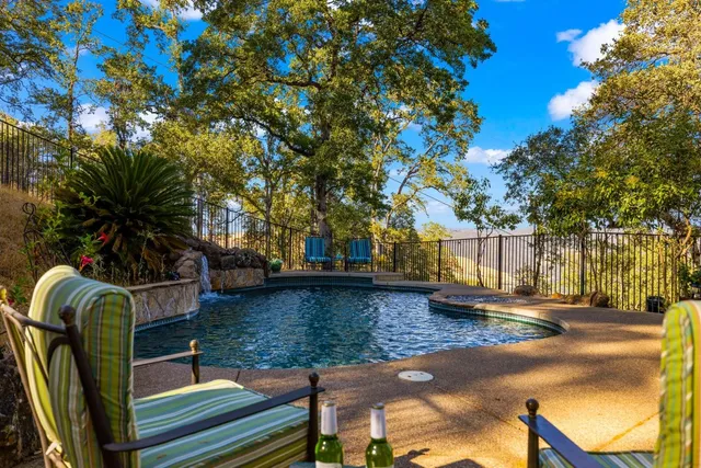 a view of two chairs in the balcony