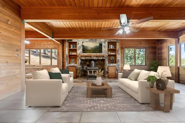 a large kitchen with stainless steel appliances granite countertop a stove and a wooden floors