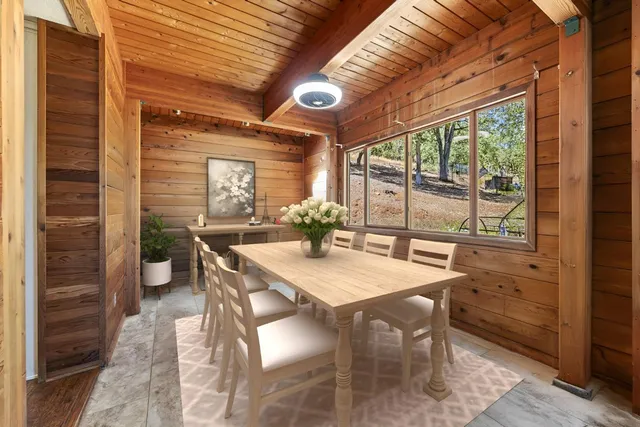 a view of a dry yard with mountains in the background