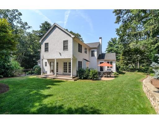 1 Dean Road Wellesley, MA 02481 - Photo 16 of 17 a front view of a house with a yard table and chairs