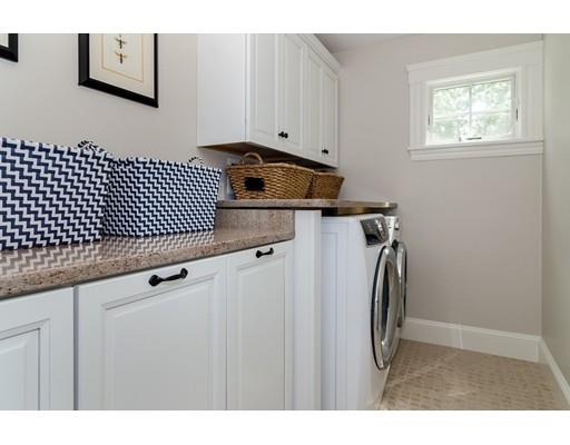 1 Dean Road Wellesley, MA 02481 - Photo 10 of 17 a kitchen with a refrigerator and white cabinets