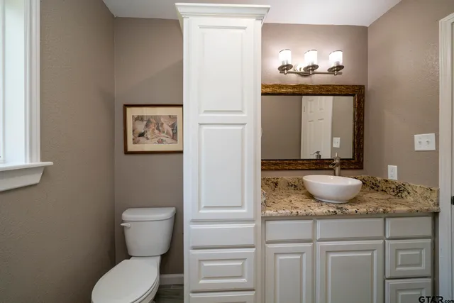 a bathroom with a bathtub and window