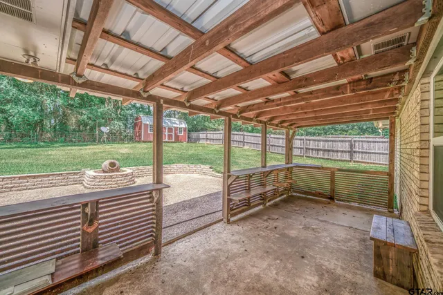 a front view of a house with a garden and yard