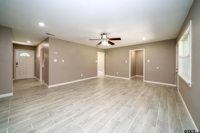 a view of an empty room with a window