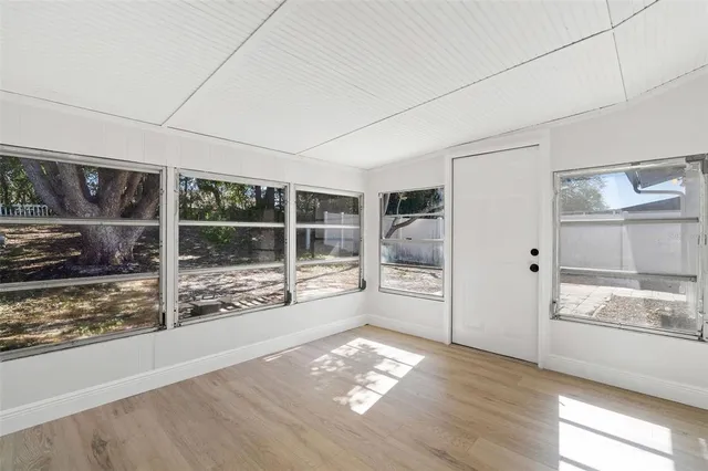 a view of a refrigerator in kitchen and wooden floor