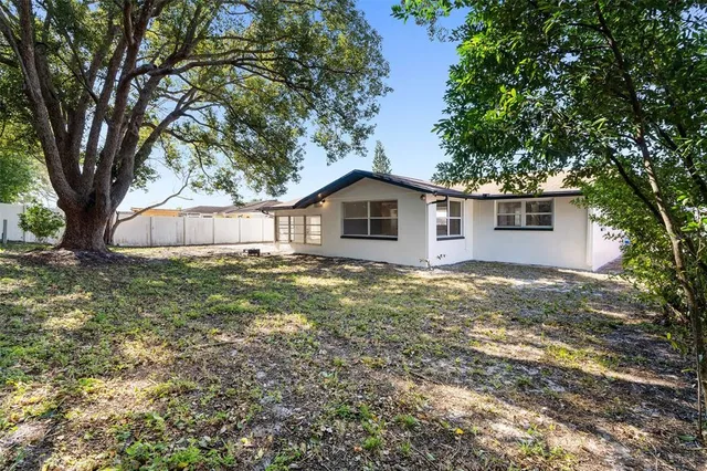 a house with trees in the background