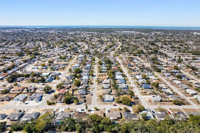 an aerial view of residential building and car parked