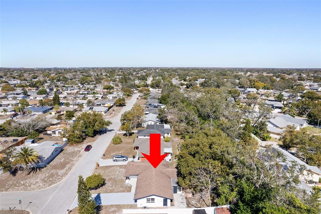10536 Laburnum Drive Port Richey, FL 34668 - Photo 31 of 33 an aerial view of residential building and car parked