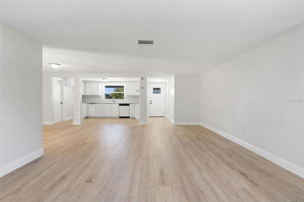 10536 Laburnum Drive Port Richey, FL 34668 - Photo 9 of 33 a view of empty room with wooden floor