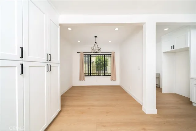 a view of an entryway with wooden floor