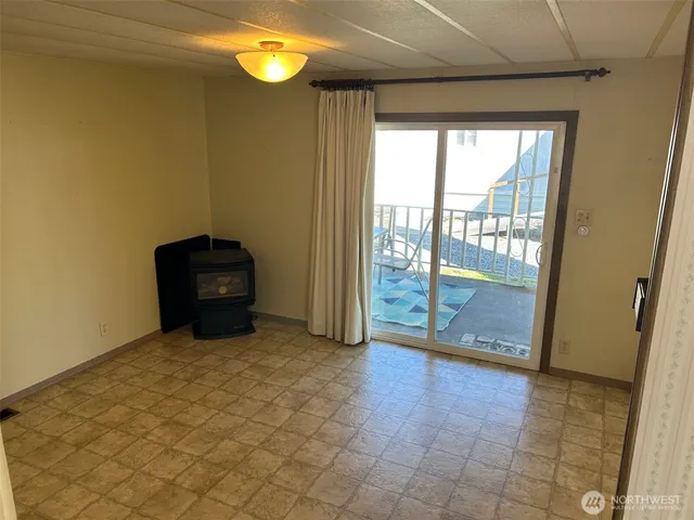 a view of a kitchen with a sink and a fireplace