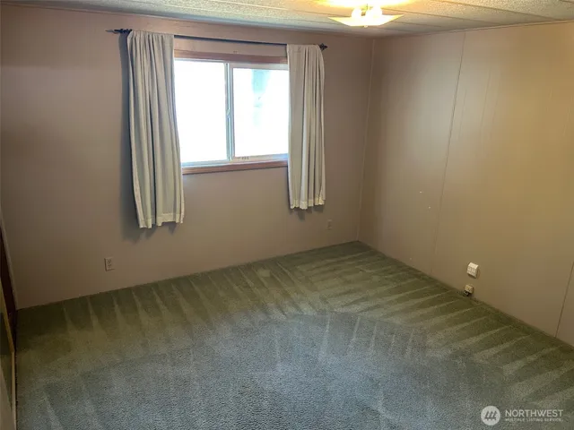 a view of entryway with wooden walls