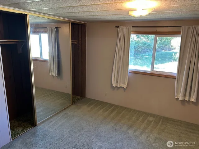 a bathroom with a sink vanity and toilet